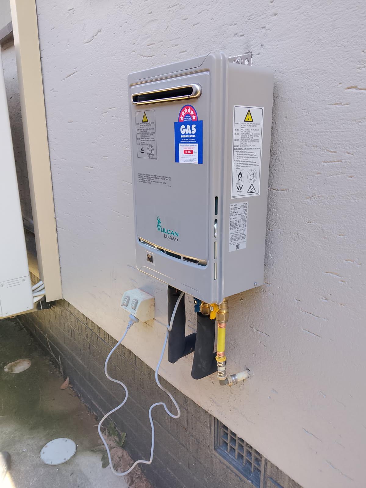 Vulcan Duomax continuous flow gas hot water system installed on a Canberra wall